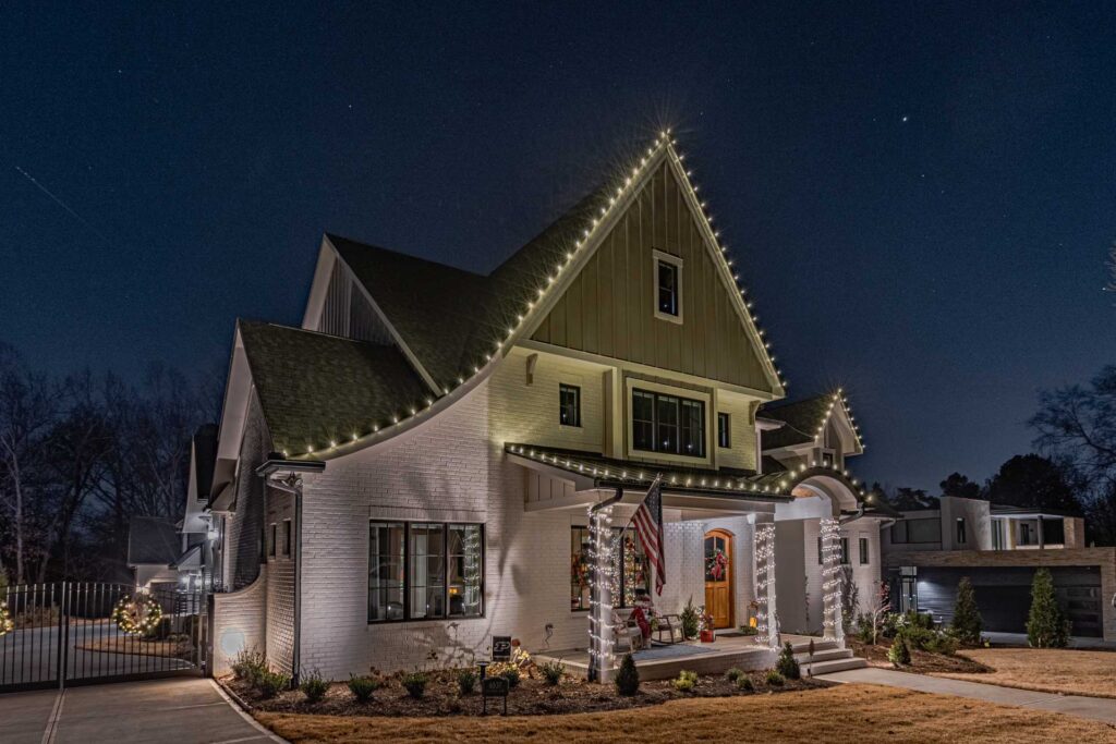 Professional Christmas light installers at work