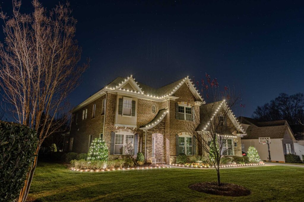 Holiday light installation on a residential property