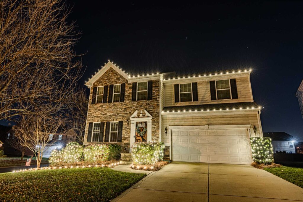 Professional Christmas light service on a decorated property