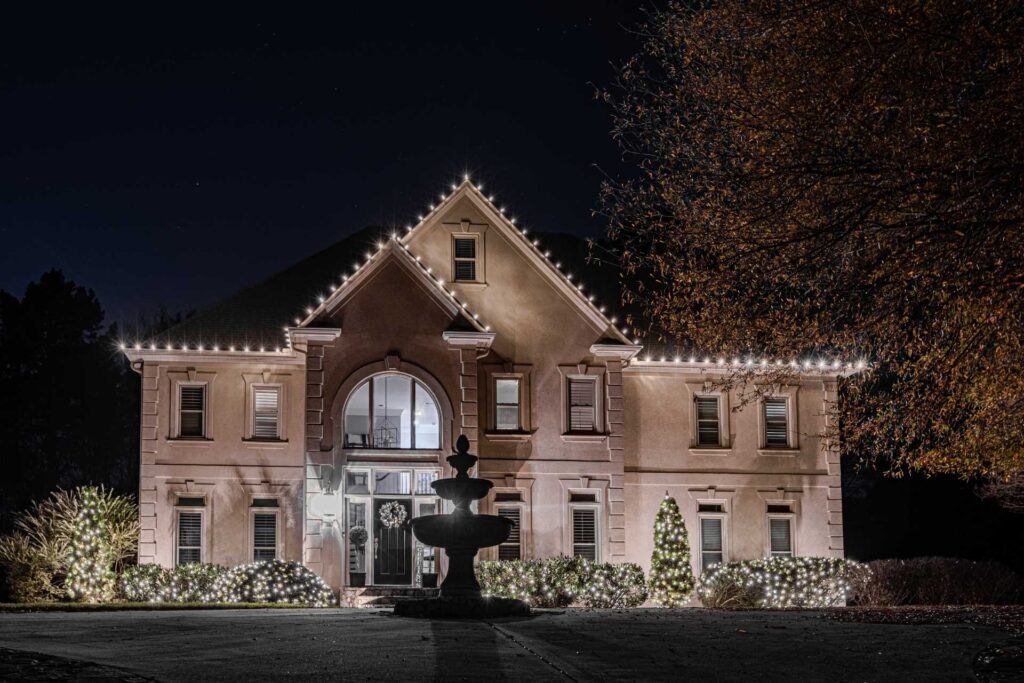 Roofline Christmas lights installed on a home